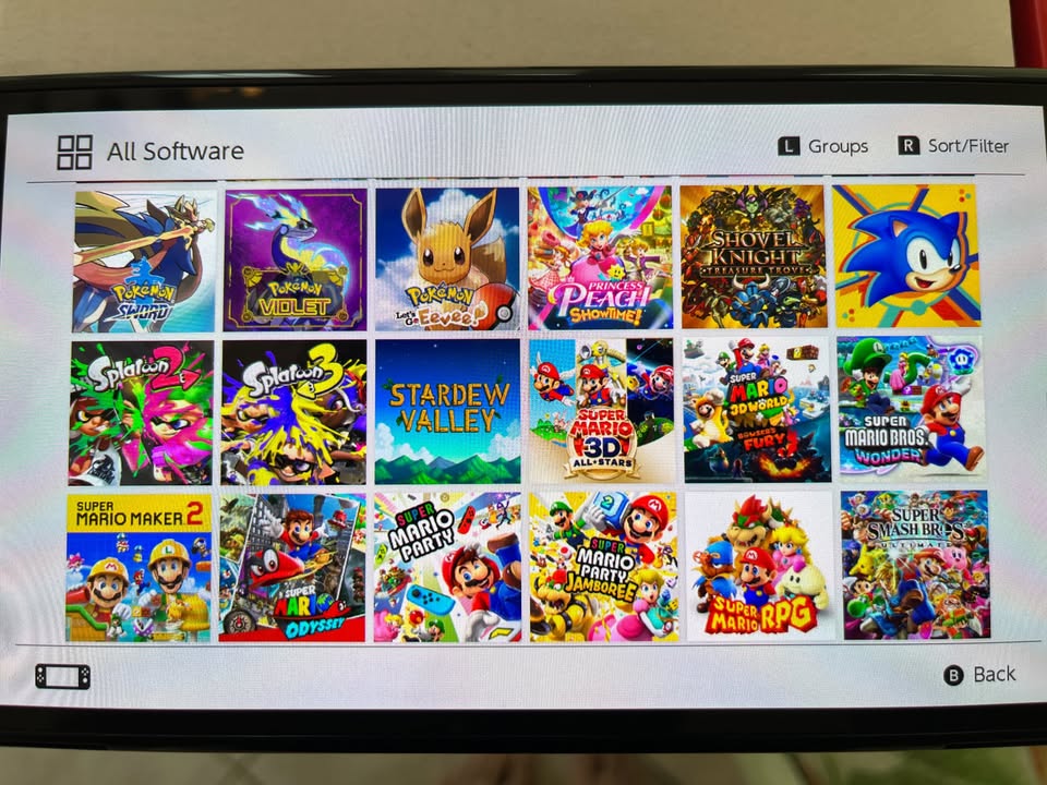 (Brand New) Nintendo Switch OLED with 60+ games